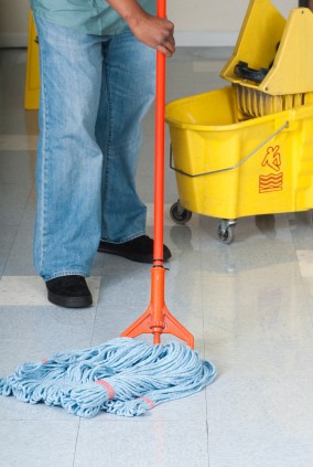 K & S Office Cleaners LLC janitor in Richmond, VA mopping floor.